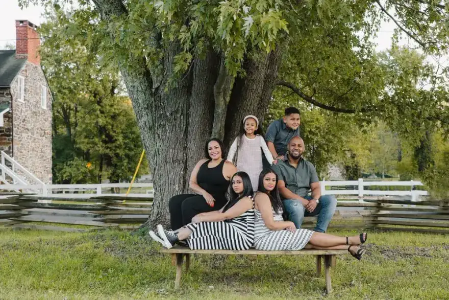 Multigenerational family portrait under a large tree by Create With Amy, photographer for family portraits in Maryland